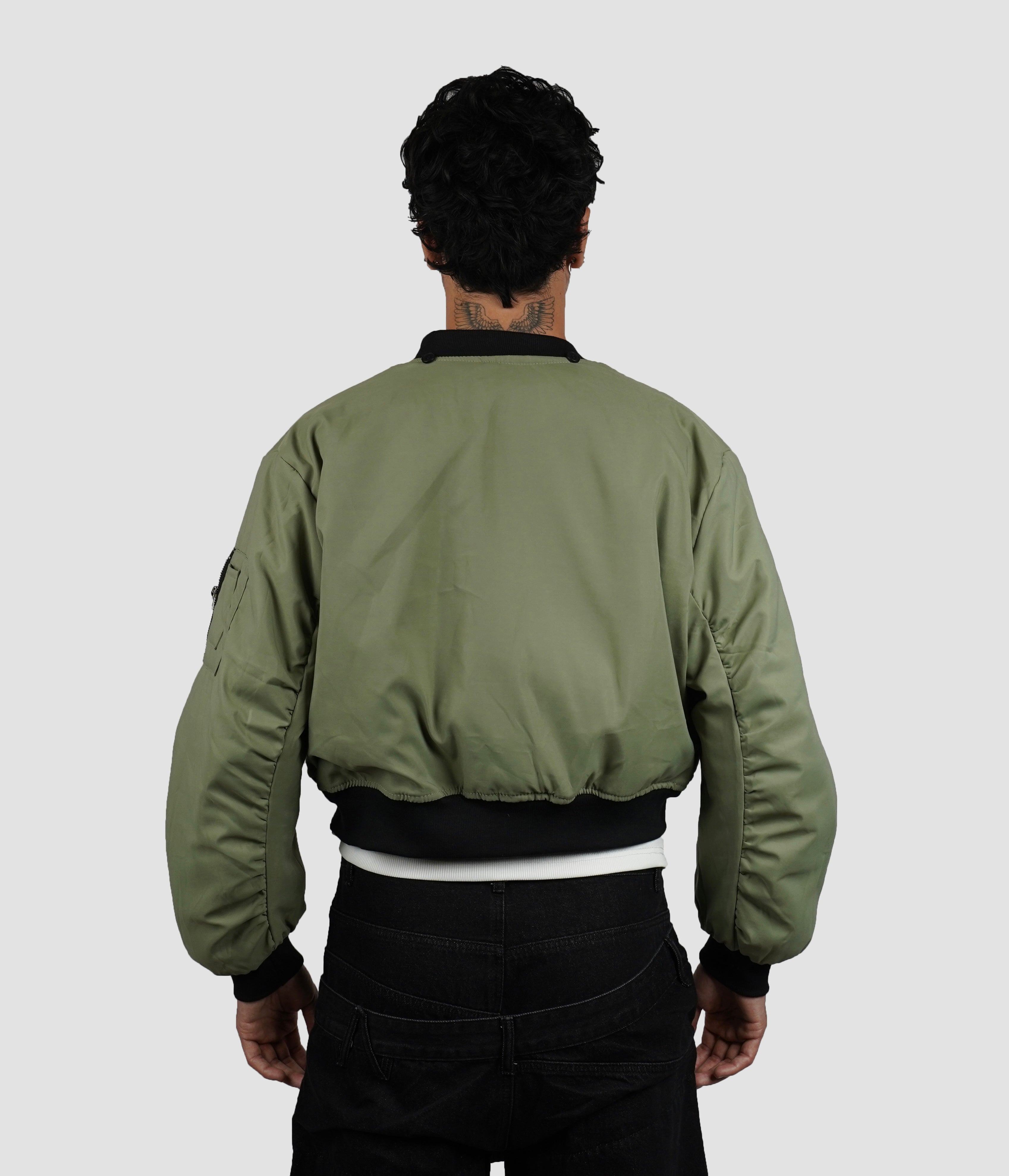 Reversible bomber with detachable hood